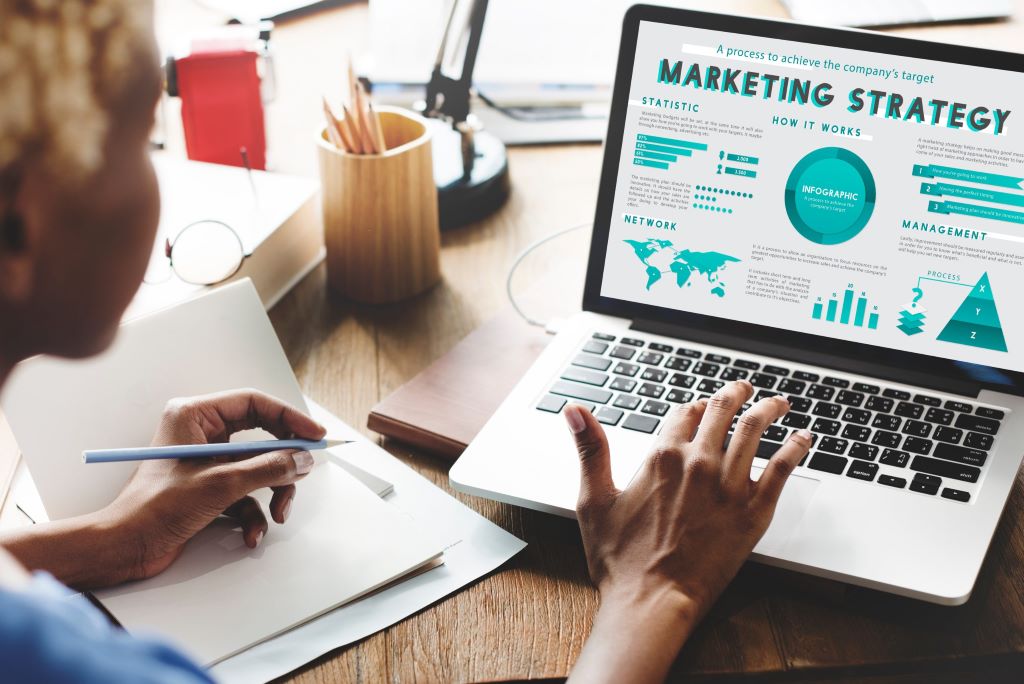 Marketing team sharing press release online to boost business exposure through media coverage