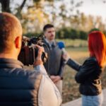 Business owner speaking with journalists to secure media coverage and publicity